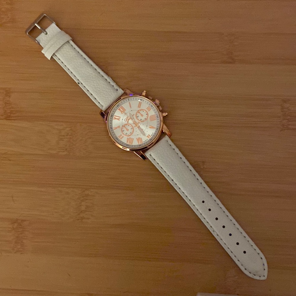 Genevo Platinum Quartz Movt watch with rose gold accented face and grey band
